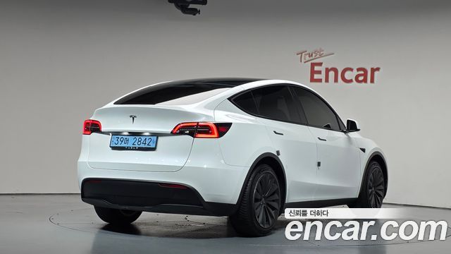 2023 Tesla Model Y, VIN LRWYGCFS7PC104418