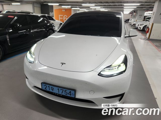 2024 Tesla Model Y, VIN LRWYGCFSXRC409186