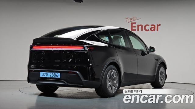 2026 Tesla Model Y, VIN LRWYGCEK7TC929676